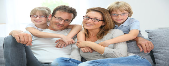 Portrait Of Happy Family Of Four Wearing Eyeglasses
